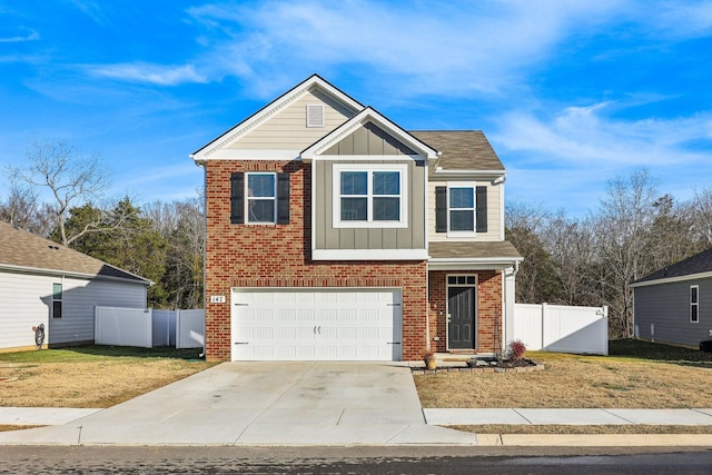 view of front of property featuring a garage and a front yard