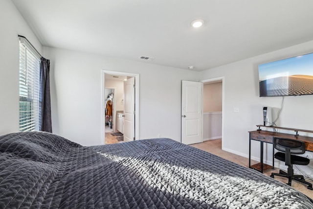 bedroom featuring light carpet