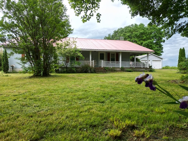 1063 Rabbit Trail Rd, Five Points, TN 38457 - farmhouse inspired home with a porch, metal roof, and a front yard