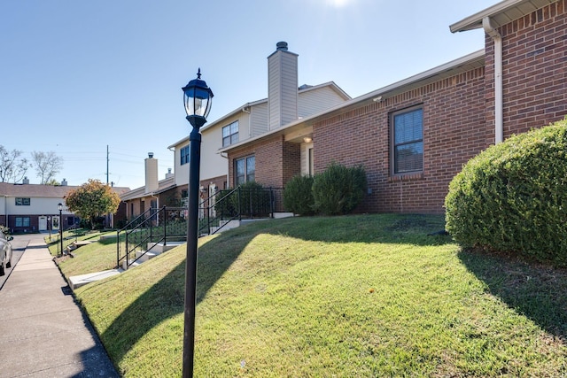 view of property exterior featuring a lawn