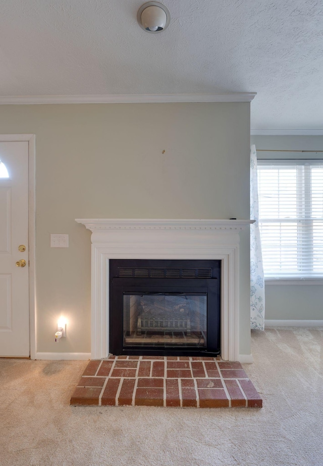 details with crown molding, carpet flooring, and a textured ceiling