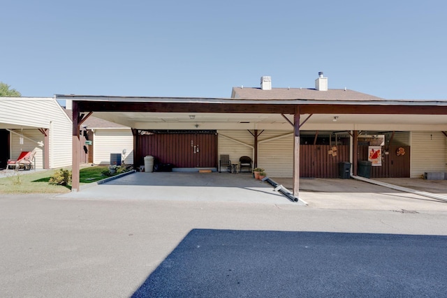 view of car parking featuring a carport