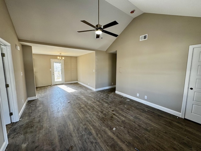 unfurnished living room featuring dark wood-type flooring, lofted ceiling, and ceiling fan with notable chandelier