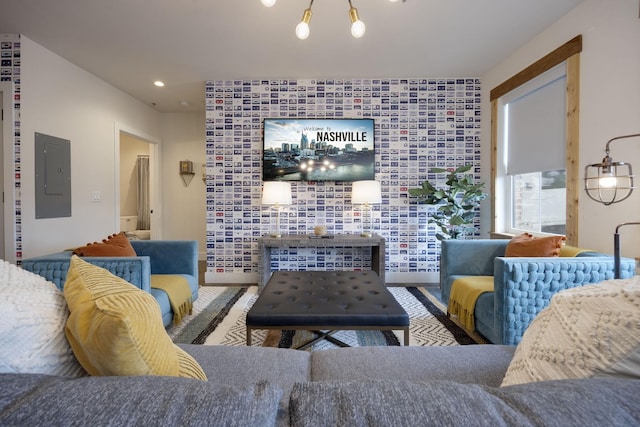 living room with wood-type flooring and electric panel