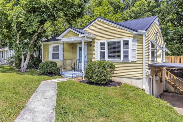 bungalow-style house with a front yard