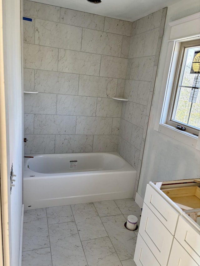 bathroom with tiled shower / bath combo