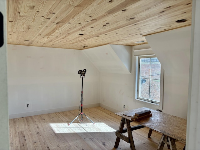 bonus room with vaulted ceiling, light hardwood / wood-style flooring, and wooden ceiling