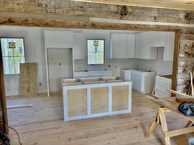 kitchen featuring white cabinetry and light hardwood / wood-style flooring