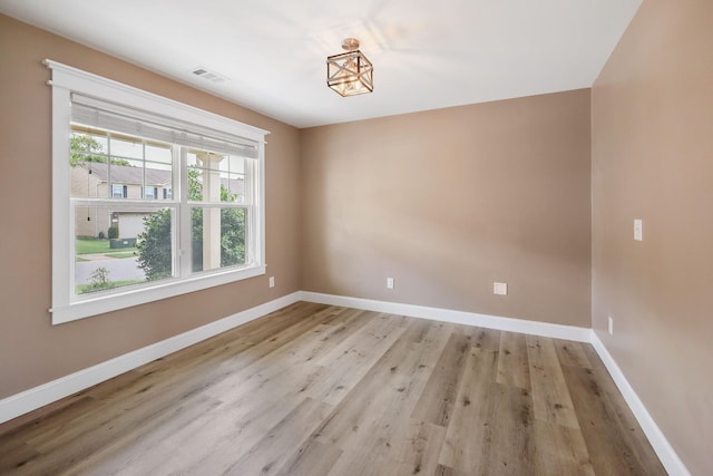 spare room with light wood-type flooring