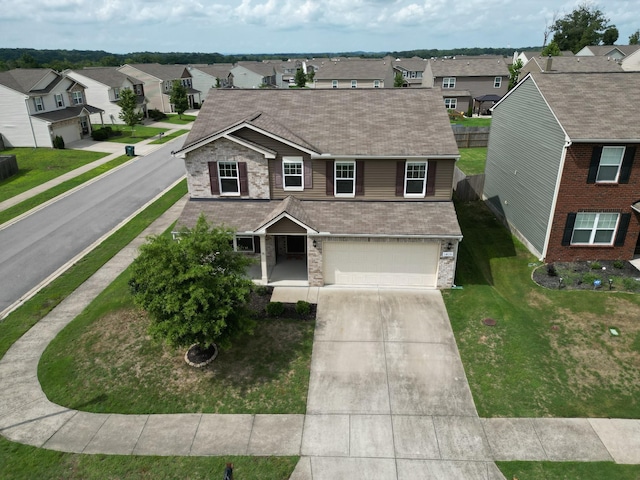 view of front of home with a garage and a front yard