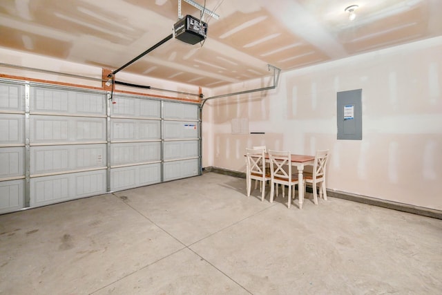 garage featuring a garage door opener and electric panel