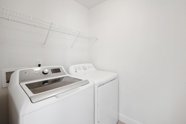 laundry area featuring washing machine and clothes dryer