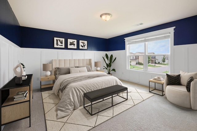 bedroom featuring light colored carpet