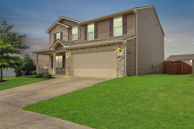 craftsman-style home with a garage and a lawn