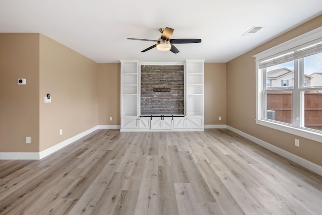 unfurnished living room with ceiling fan and light wood-type flooring