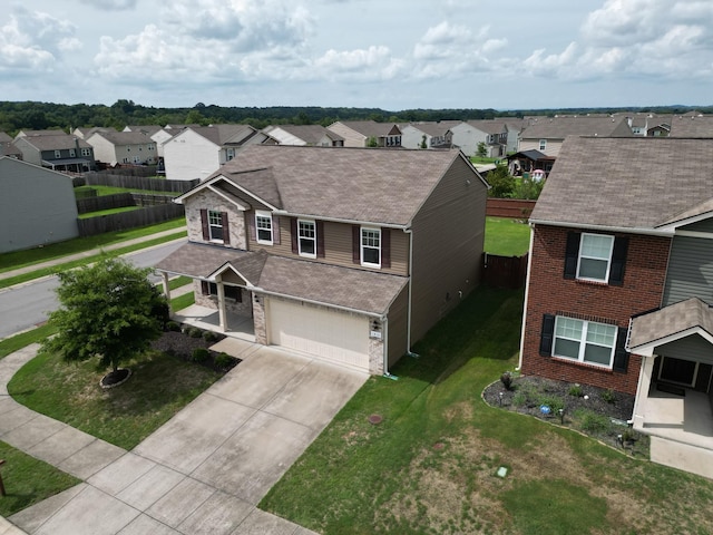 view of front of home with a garage and a front yard