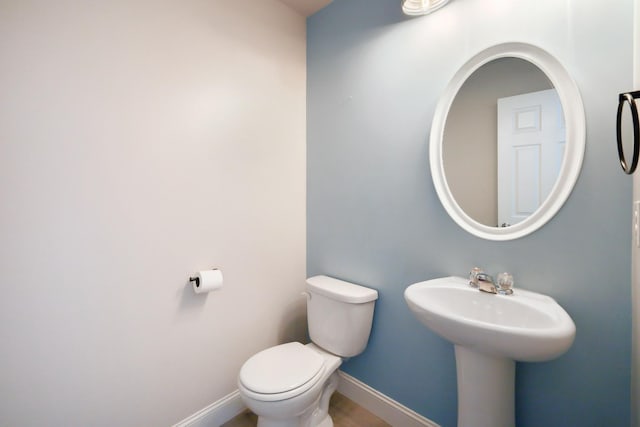 bathroom featuring sink and toilet