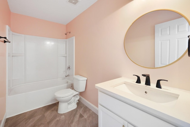 full bathroom featuring  shower combination, vanity, and toilet