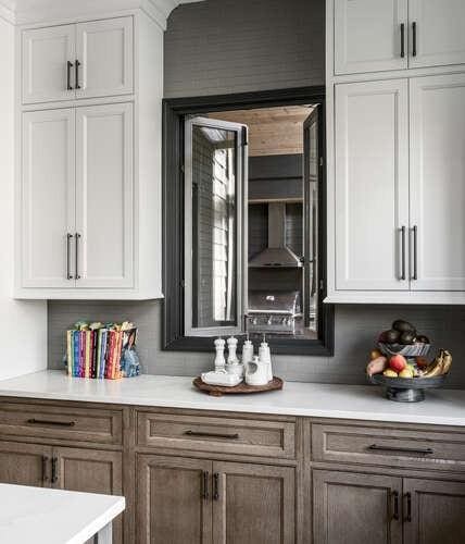 bar featuring white cabinetry and backsplash