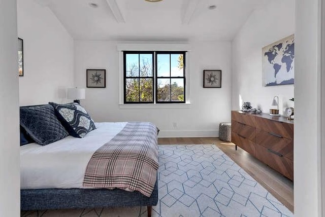 bedroom with wood finished floors and baseboards