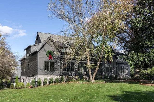 view of home's exterior featuring a lawn