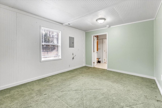 carpeted spare room featuring ornamental molding and electric panel