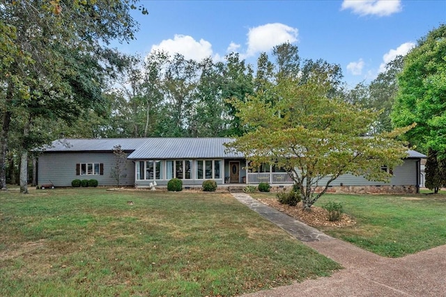 single story home with a porch and a front lawn