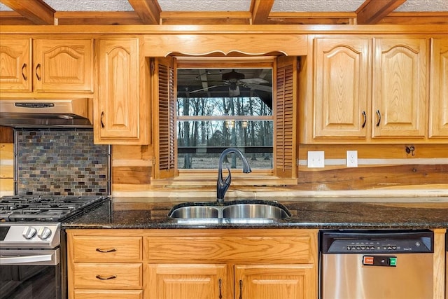 kitchen with sink, dark stone countertops, appliances with stainless steel finishes, decorative backsplash, and exhaust hood