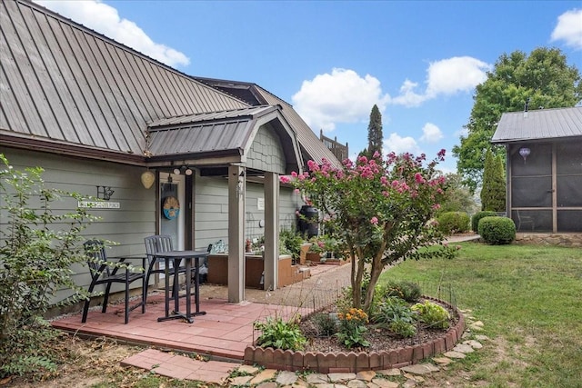 view of yard with a sunroom and a patio area