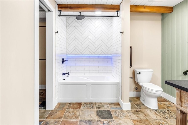 bathroom featuring tiled shower / bath combo, wood ceiling, beam ceiling, and toilet