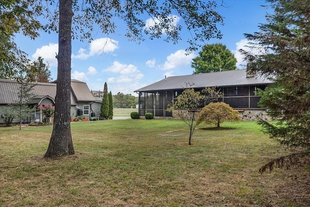 view of yard featuring a sunroom