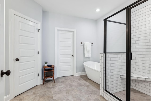 bathroom with separate shower and tub