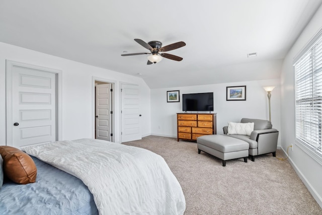 bedroom featuring vaulted ceiling, ceiling fan, and light colored carpet