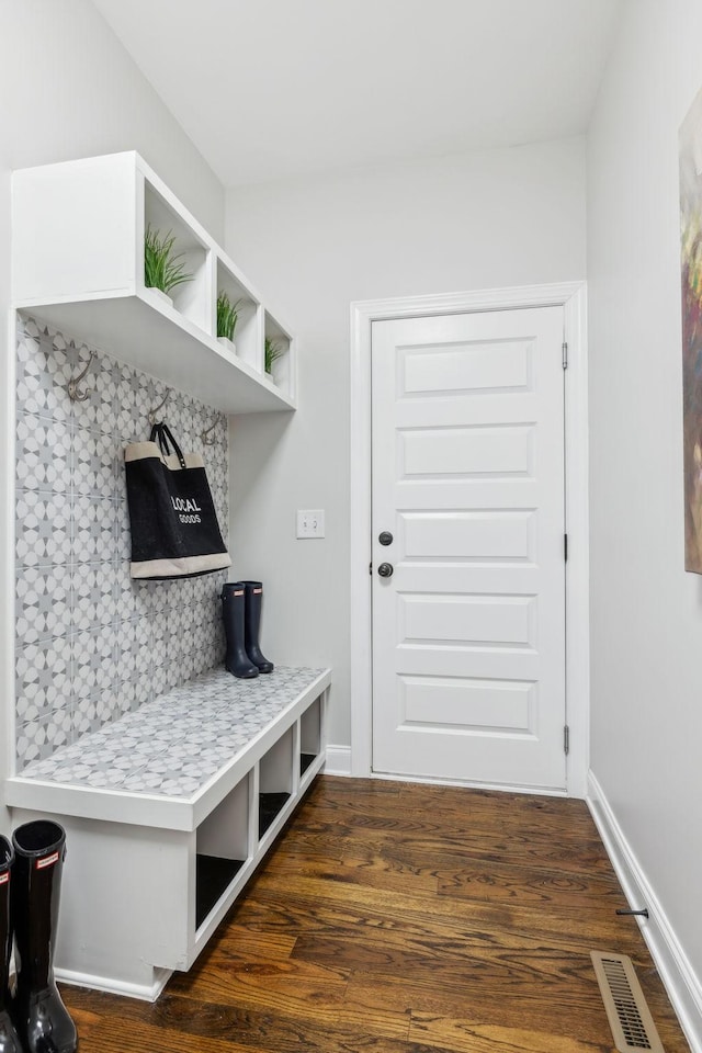 mudroom with dark wood-type flooring