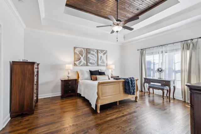 bedroom with dark wood-type flooring, ceiling fan, crown molding, and a raised ceiling