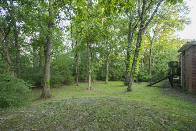 view of yard with a wooded view