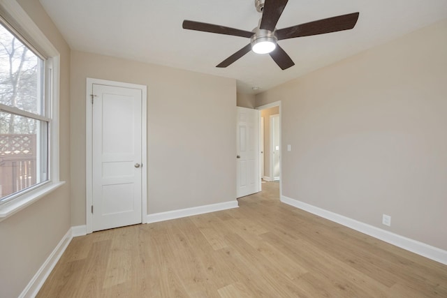 unfurnished bedroom with ceiling fan and light hardwood / wood-style flooring