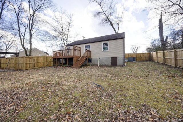 back of house with a deck and central air condition unit