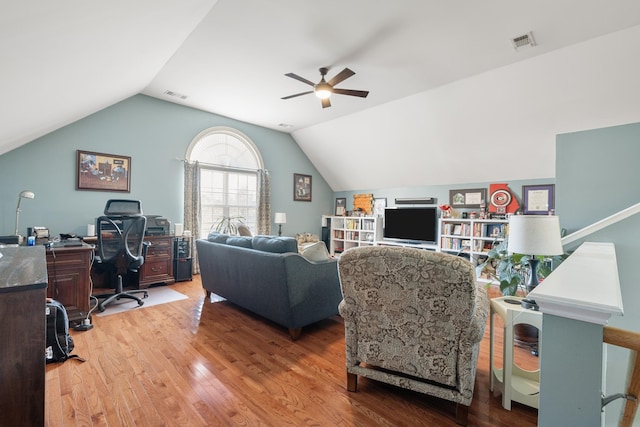 living room featuring lofted ceiling, hardwood / wood-style floors, and ceiling fan