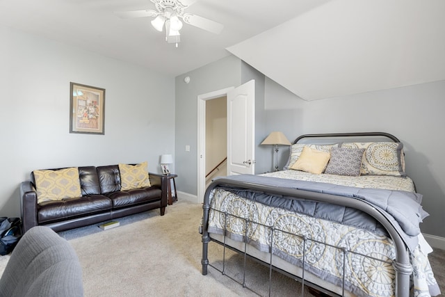 carpeted bedroom with vaulted ceiling and ceiling fan