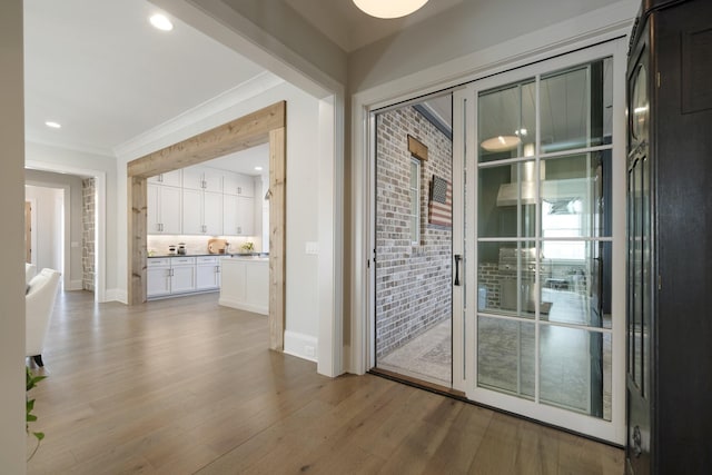 doorway with light hardwood / wood-style flooring