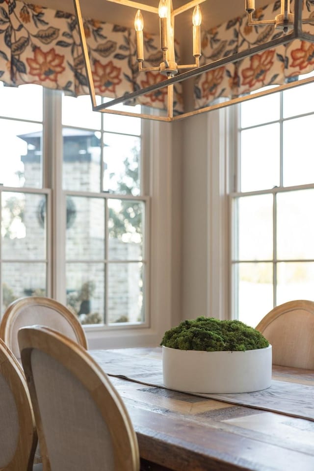 dining space with a chandelier