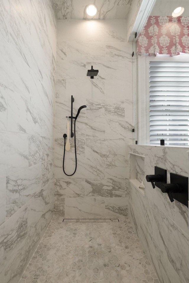 bathroom featuring a tile shower