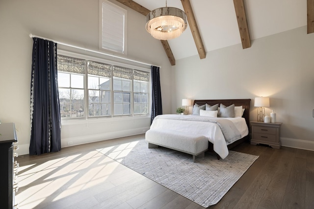 bedroom with high vaulted ceiling, hardwood / wood-style floors, and beam ceiling