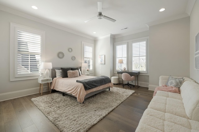 bedroom featuring dark wood-type flooring, ceiling fan, and ornamental molding