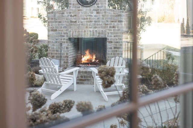 exterior space featuring a fireplace and a patio area