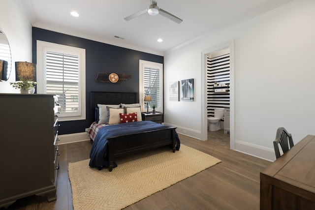 bedroom with connected bathroom, dark wood-type flooring, and ceiling fan