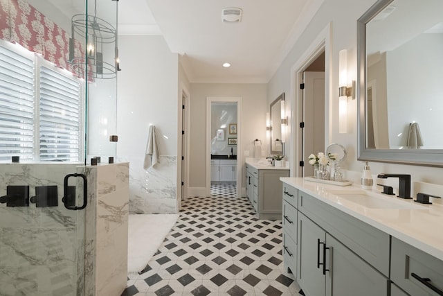 bathroom with vanity, ornamental molding, a chandelier, and walk in shower