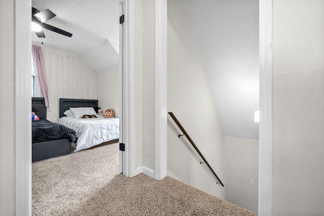 carpeted bedroom with lofted ceiling and ceiling fan