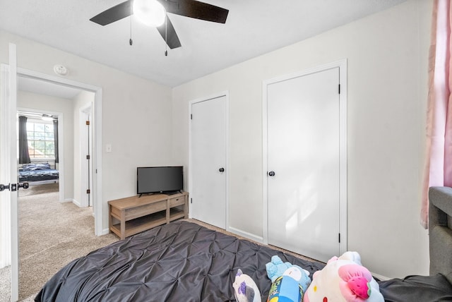 carpeted bedroom with ceiling fan